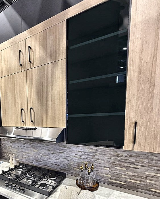 Ultimate Euro kitchen: Natural White Oak wall cabinets and a Tinted Glass wall cabinet over a stainless range hood