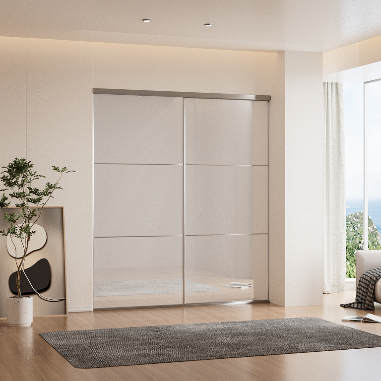 White glass sliding closet doors with black aluminum frame in a bedroom