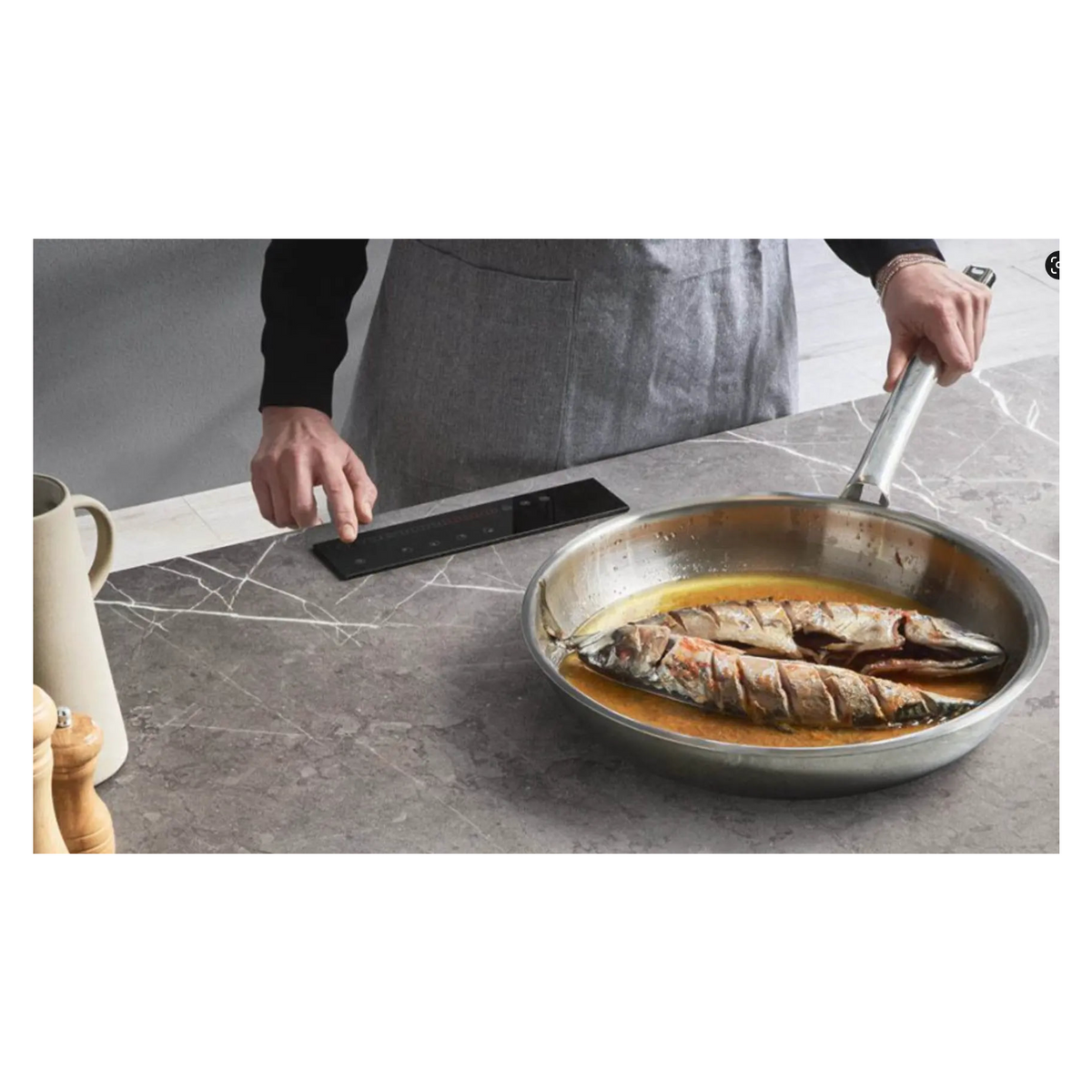 Invisacook under-counter induction: pan cooking directly on a porcelain countertop